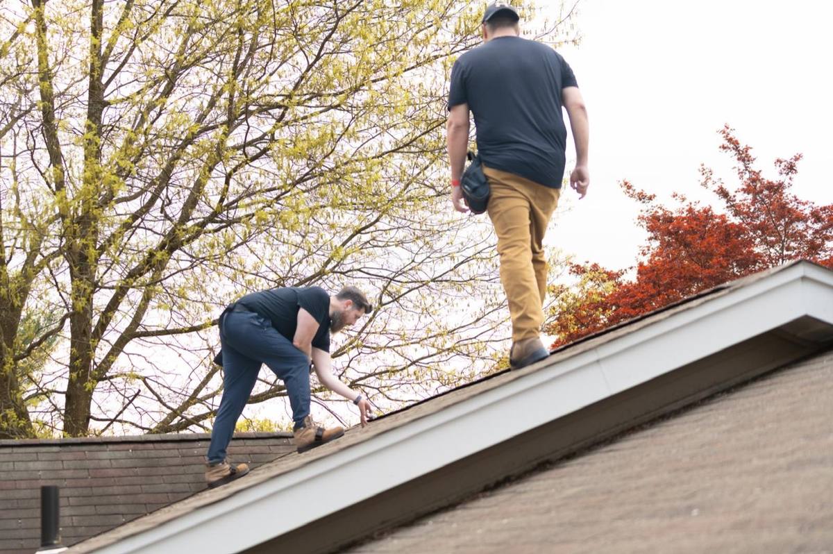 Josh and Drew inspecting a residential roof